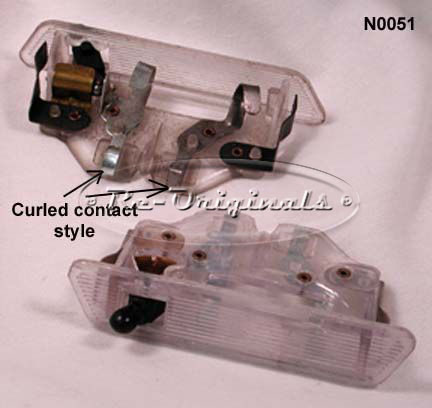 Rear view mirror light assembly only, NOS.  Style with two metal fingers that contact inside of mirror. - N0051