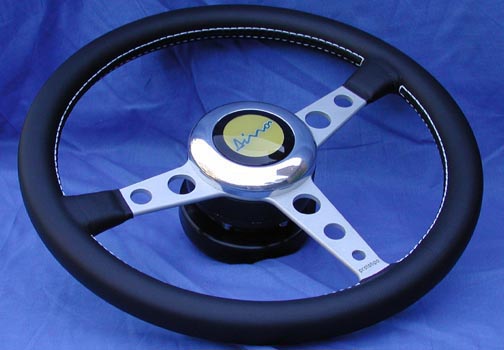 Steering wheel for competition cars, leather, includes hub and horn button, these Momo made steering wheels are reinforced for racing.  Ask us for a photo to confirm style desired. - N0132X