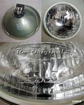 Headlight assembly,NOS, tungsten bulb.  1955-58 cars.  Number 00.497.810 on lens. - L0412
